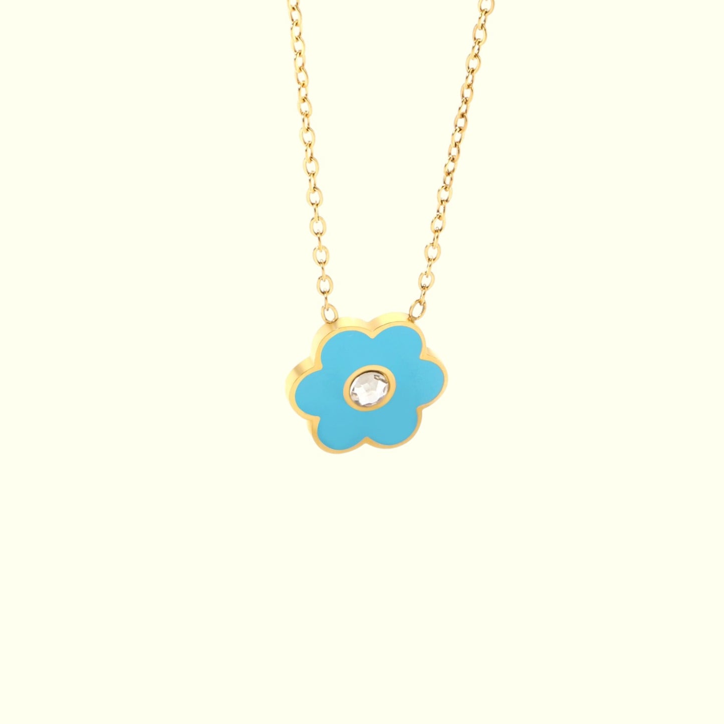 Necklace with a blue flower pendant on a white background