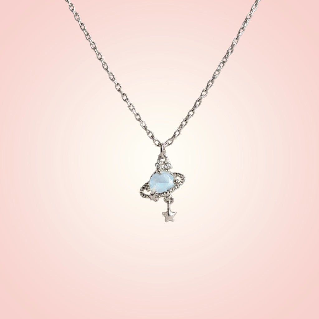 Necklace with a heart-shaped pendant on a pink gradient background