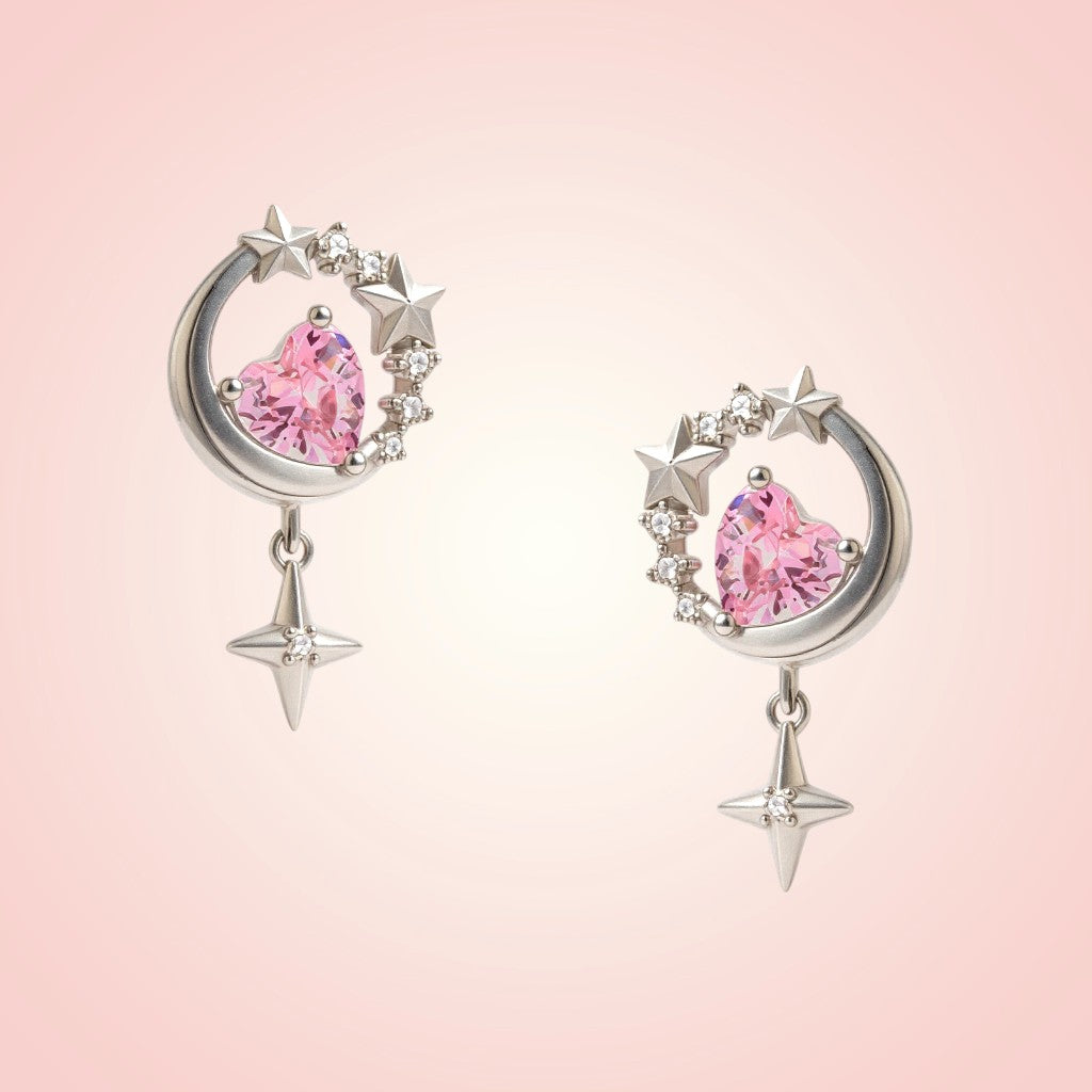 Pair of earrings with pink gemstones and silver accents on a pink background