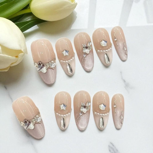 Decorative nails with flowers on a white surface