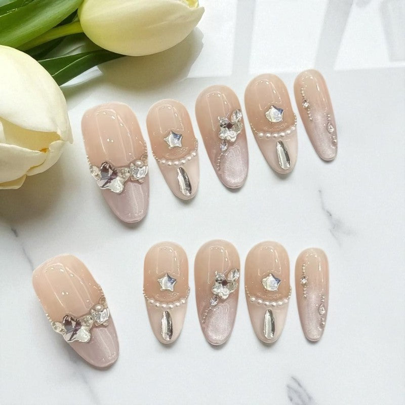 Decorative nails with flowers on a white surface