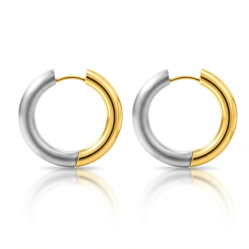 Gold and silver two-tone stainless steel hoop earrings with polished rounded design.
