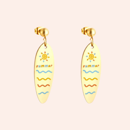 Surfboard-shaped earrings with 'summer' text and sun design on a white background