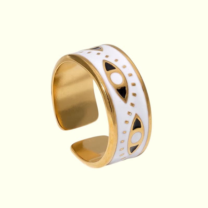 Evill eye ring with black accents on a white background