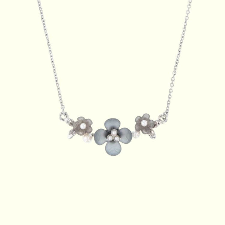 Necklace with floral pendants on a white background