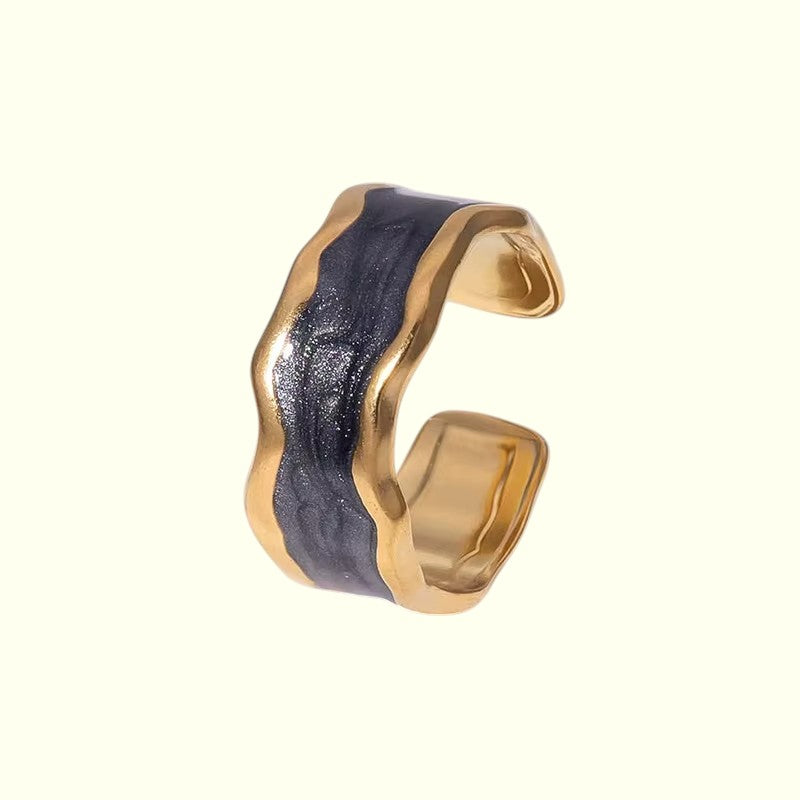 Gold and black ring on a white background