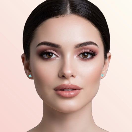 Woman wearing earrings on a beige background