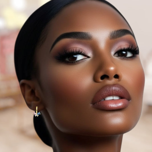 Close-up of a woman's face with makeup and earrings, blurred background