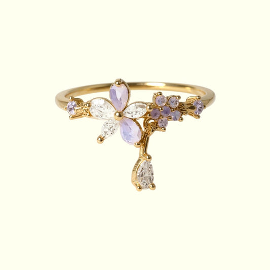 Gold ring with gemstones on a white background