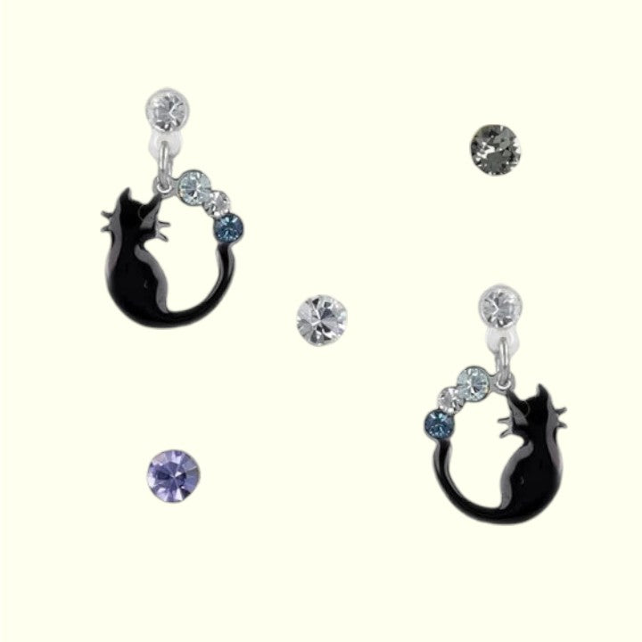 Black cat-shaped earrings with gemstones on a white background