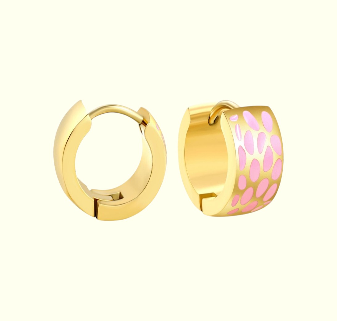 Gold hoop earrings with pink accents on a white background