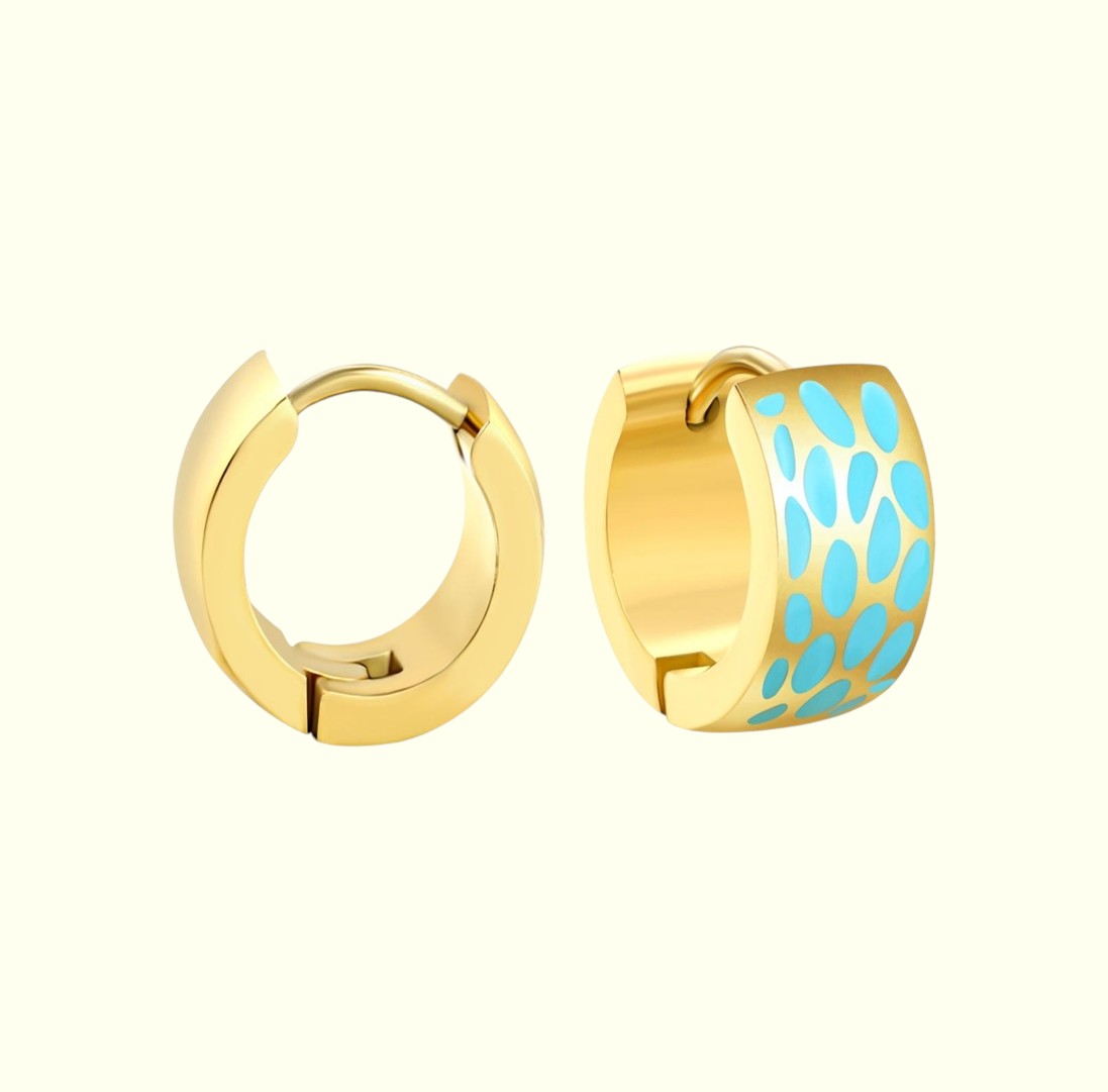 Gold hoop earrings with blue pattern on a white background