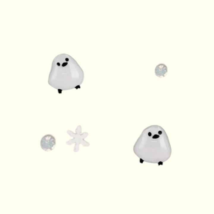 Set of ghost-shaped earrings on a white background