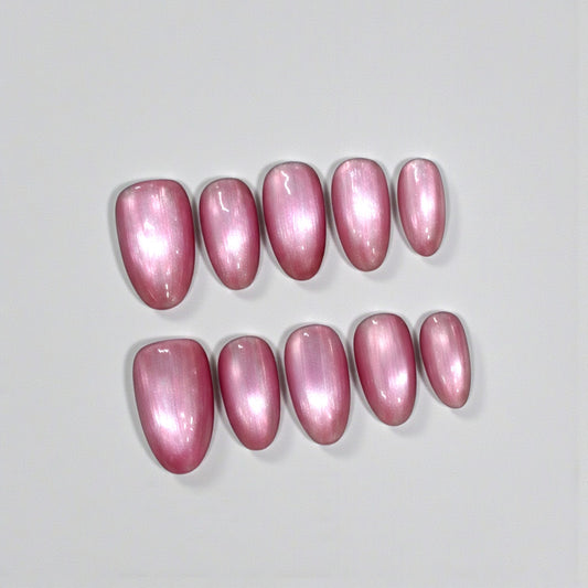 Pink nail polish samples on a light gray background