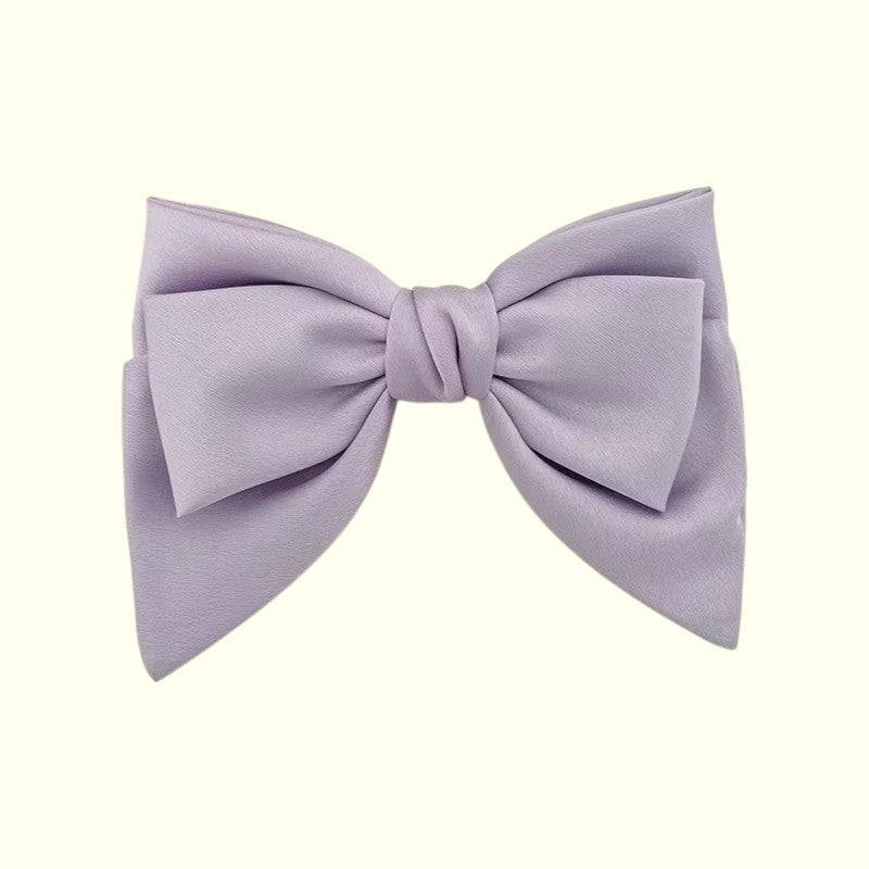 Lavender bow on a white background
