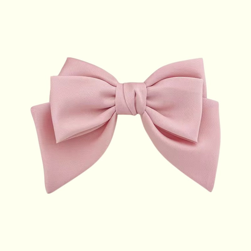 Pink bow on a white background