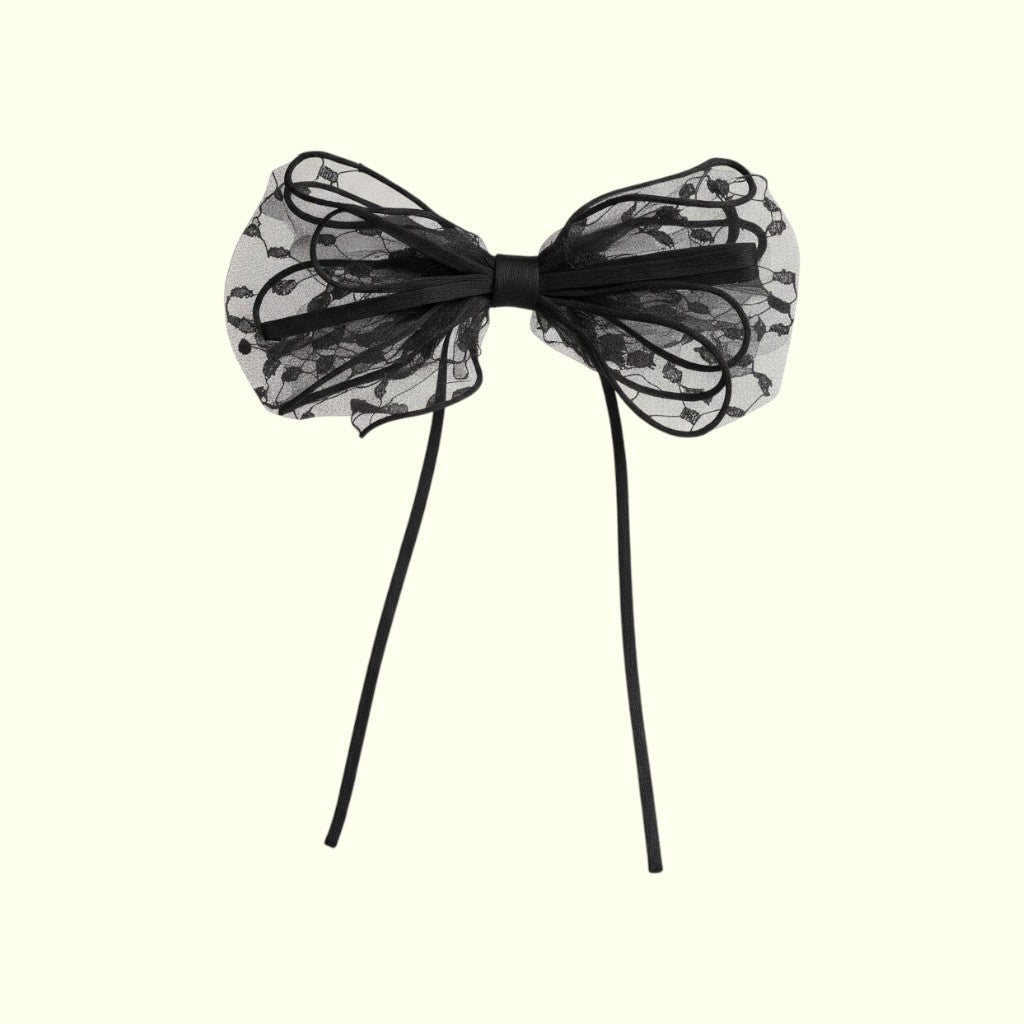 Black lace bow on a white background