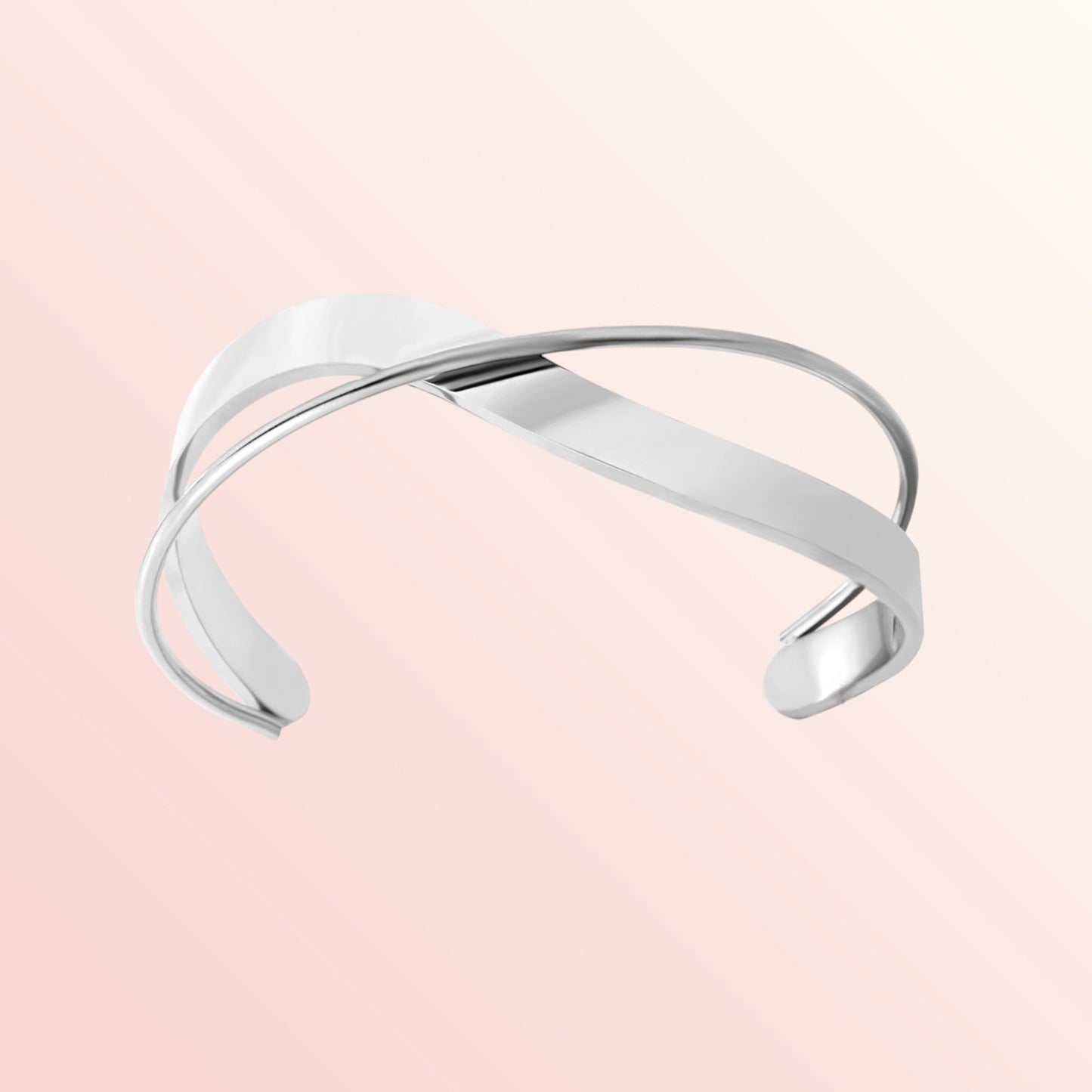 Silver bracelet on a light pink background