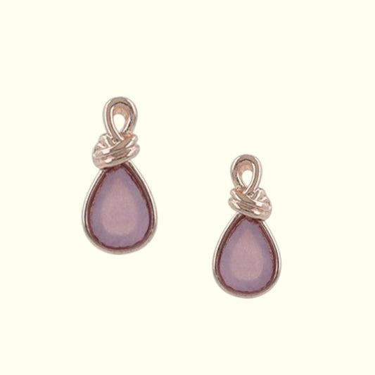 Pair of teardrop-shaped earrings with rose gold settings on a white background