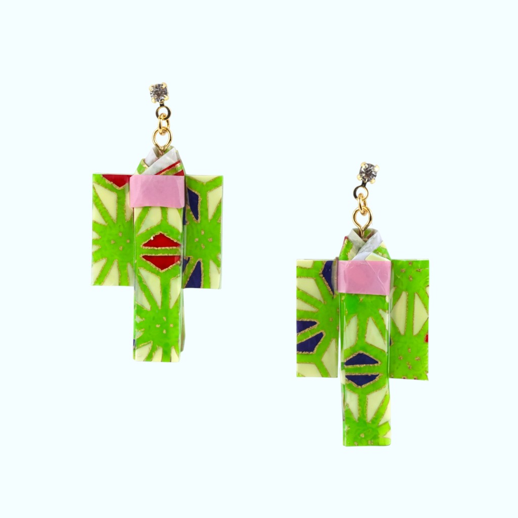 Pair of earrings with green and pink geometric design on a white background