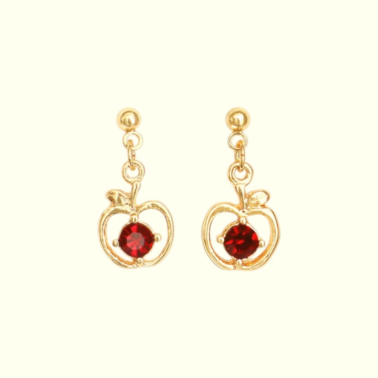 Gold earrings with red gemstones on a white background