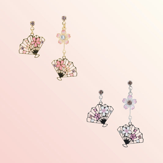 Fan-shaped earrings with floral details on a light pink background