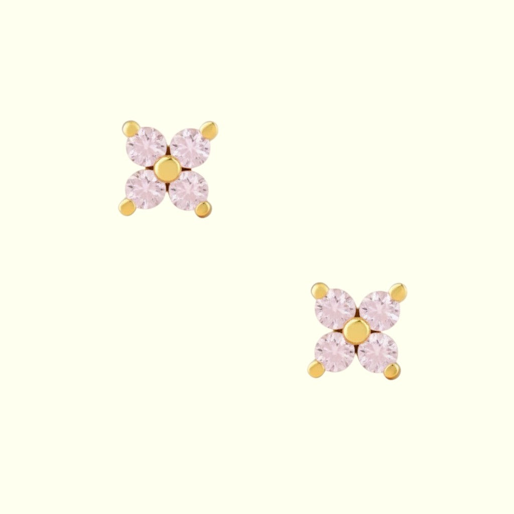 Two stud earrings on a white background