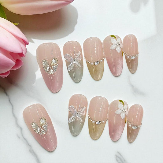 Nail art display with decorative nails on a white background