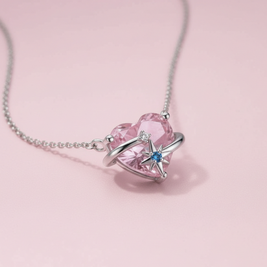 Heart-shaped pink gemstone necklace with star design on a pink background