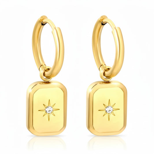Gold stainless steel hoop earrings with rectangular North Star charms and sparkling center stones.