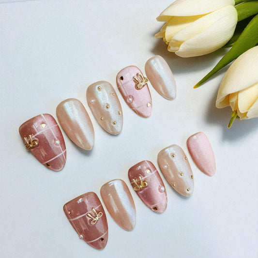 Set of decorative nails with gold accents on a white background with tulips.
