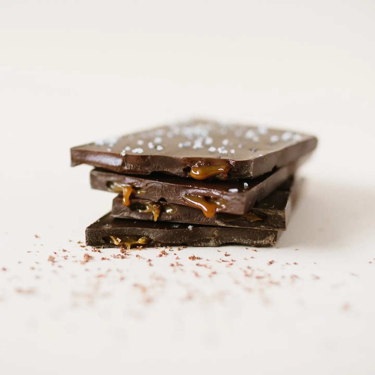 Dark chocolate with caramel pieces on a white background