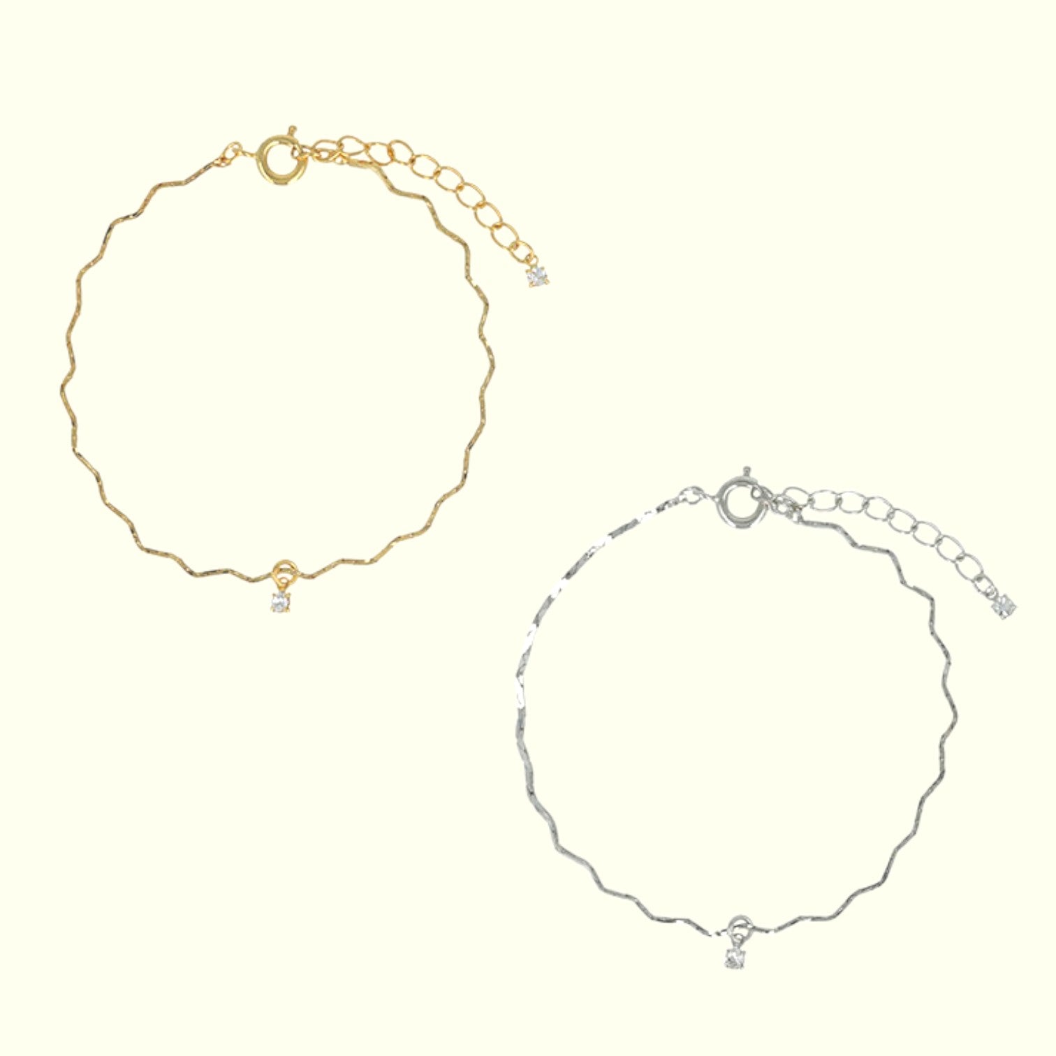 Gold and silver anklets on a white background