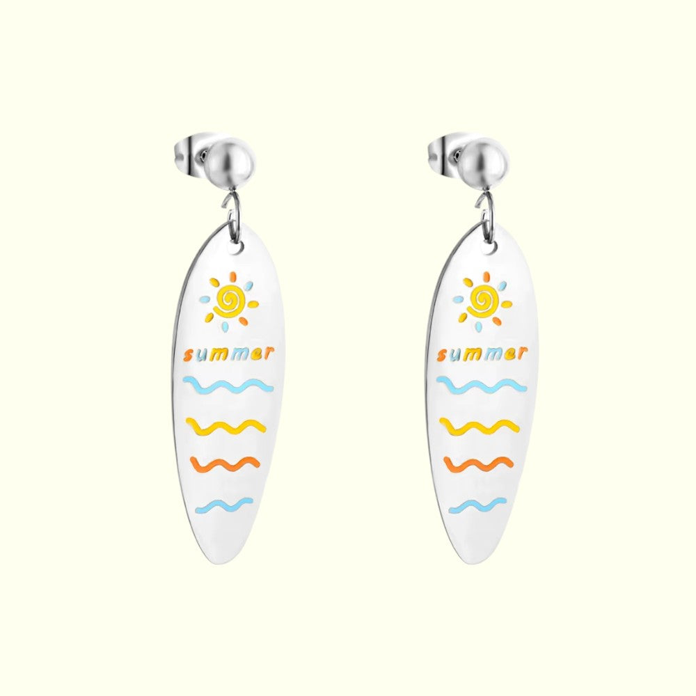 Surfboard-shaped earrings with 'summer' and sun design on a white background