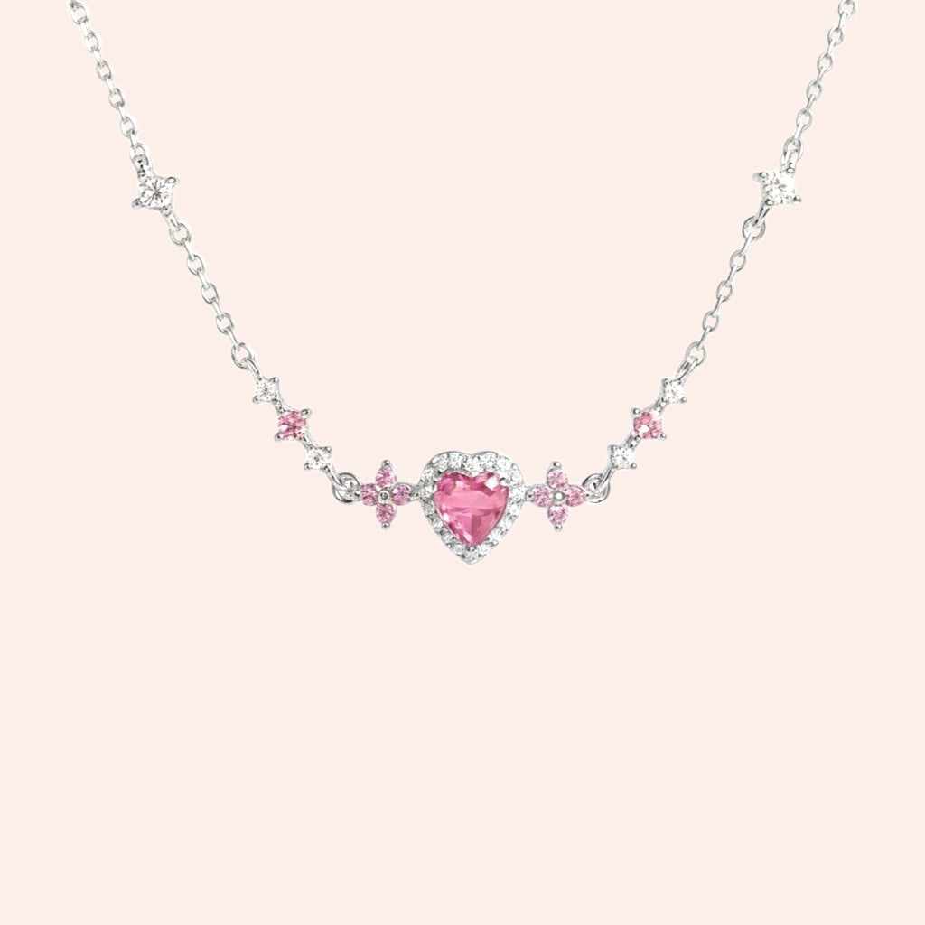 Bracelet with a pink heart-shaped gem on a light pink background