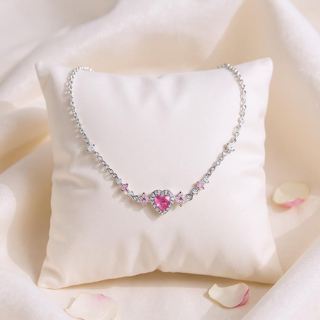 Bracelet with a pink heart gemstone on a white pillow