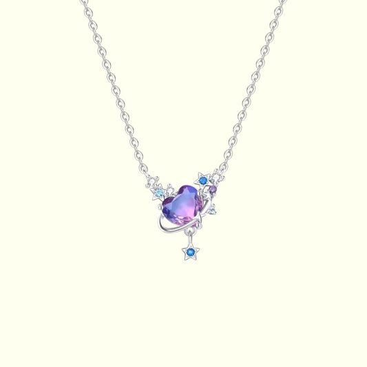 Necklace with a heart-shaped purple gem and star pendant on a white background