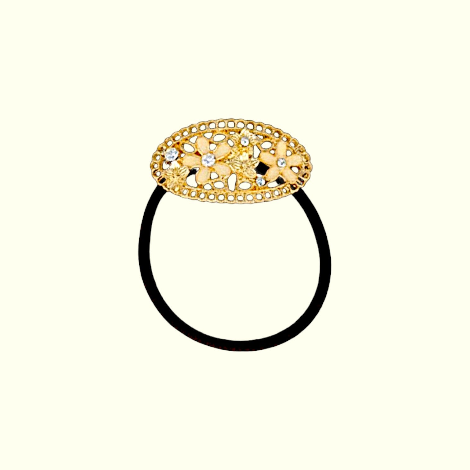Decorative gold hair tie on a white background