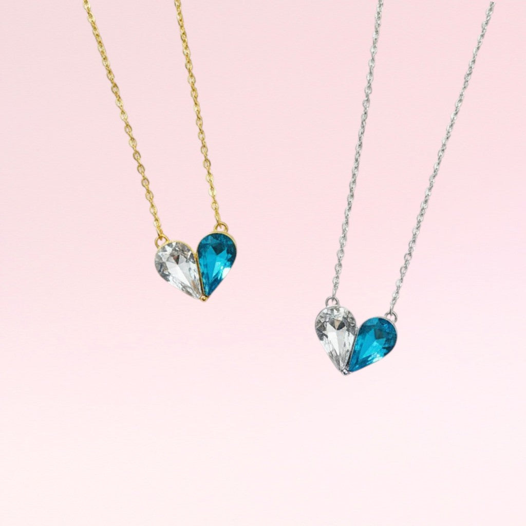 Two heart-shaped blue gemstone necklaces on pink background