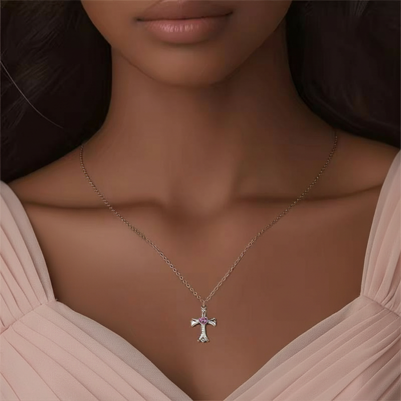 Woman wearing a necklace with a cross pendant