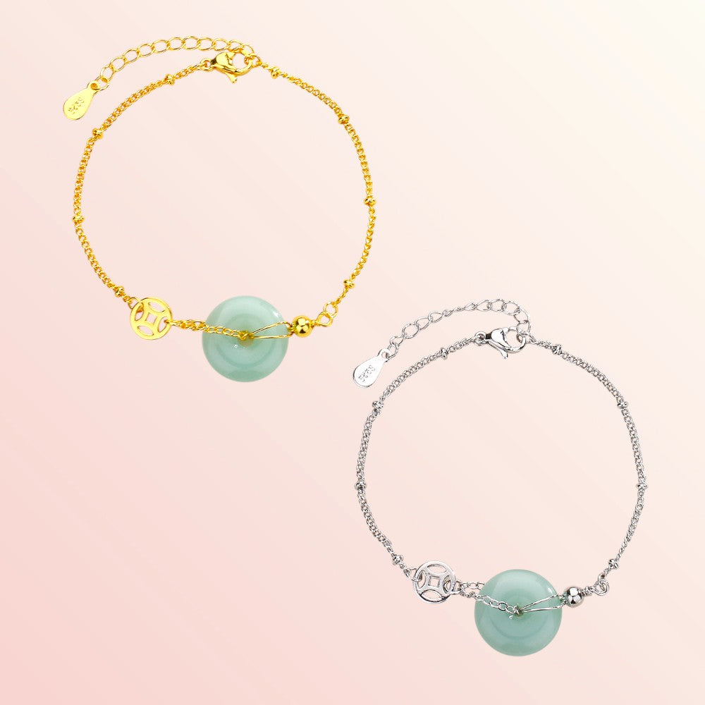 Two bracelets with turquoise beads on a pink background