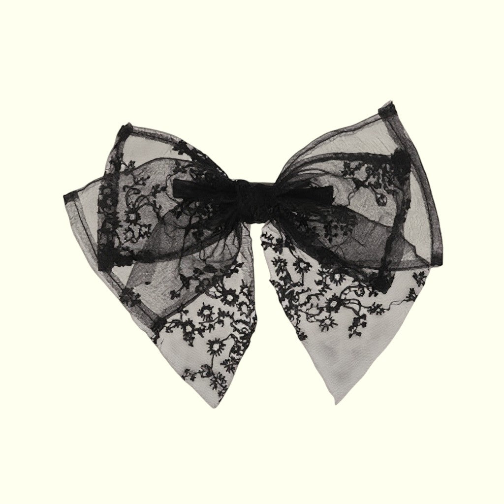 Black lace bow on a white background