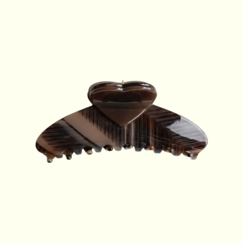 Brown hair clip on a white background