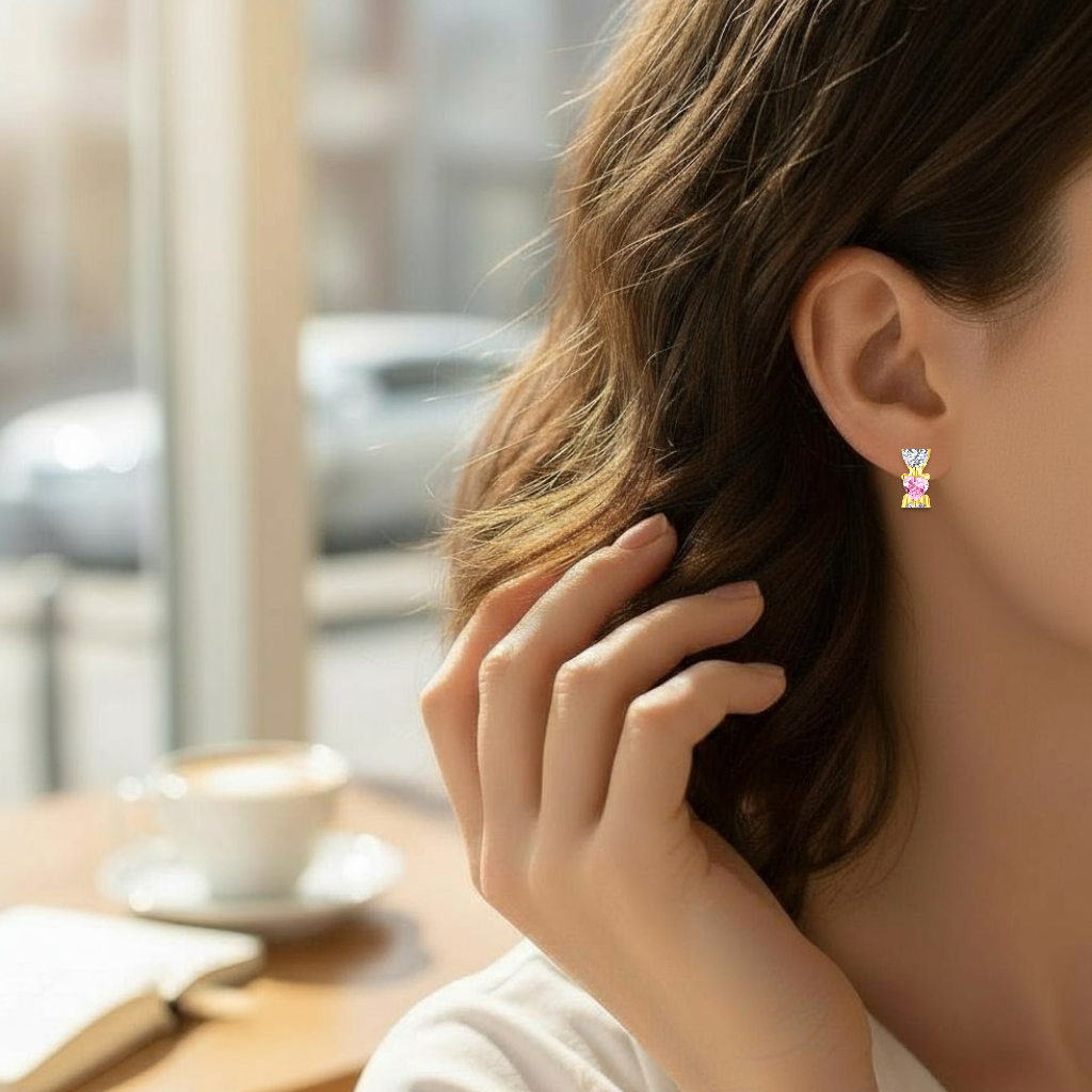 a lady wearing earrings with a blurred background of a cafe.