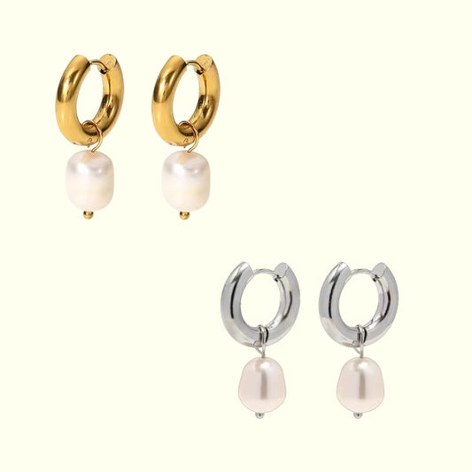 Pair of gold hoop earrings with pearl drops and two pairs of silver hoop earrings with pearl drops on a white background.