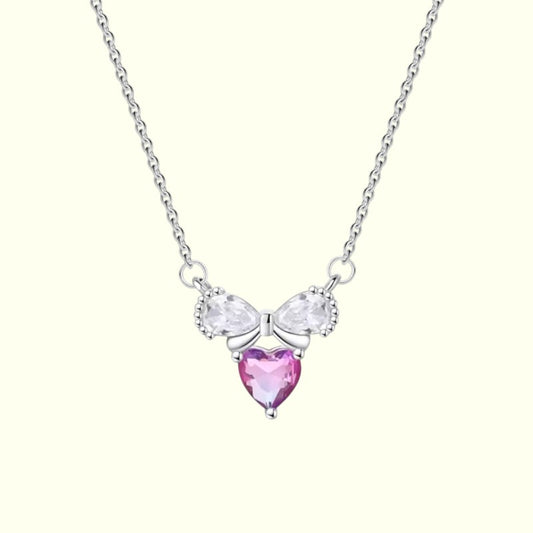 Necklace with a pink heart-shaped pendant on a white background