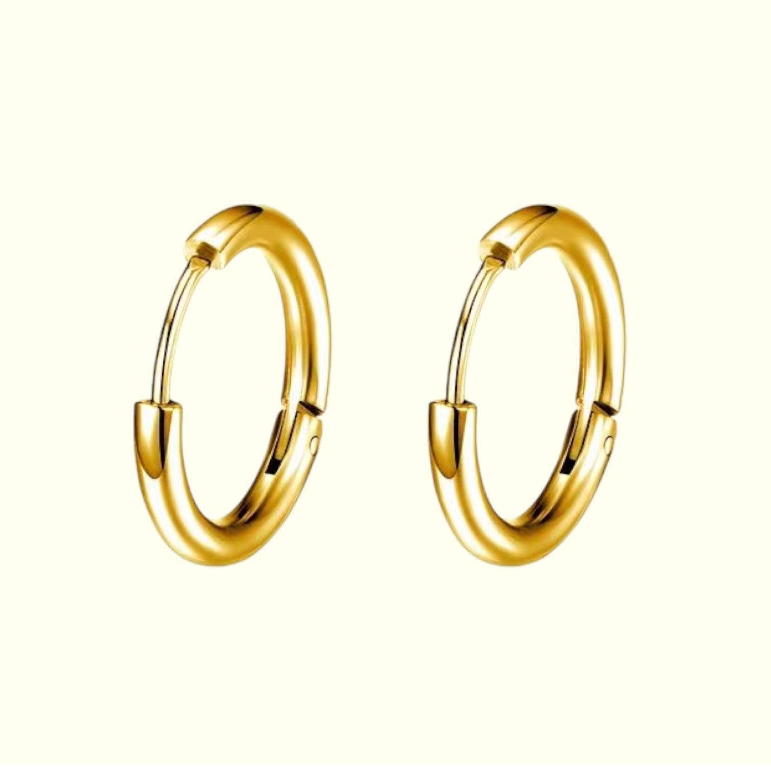 Gold hoop earrings on a white background