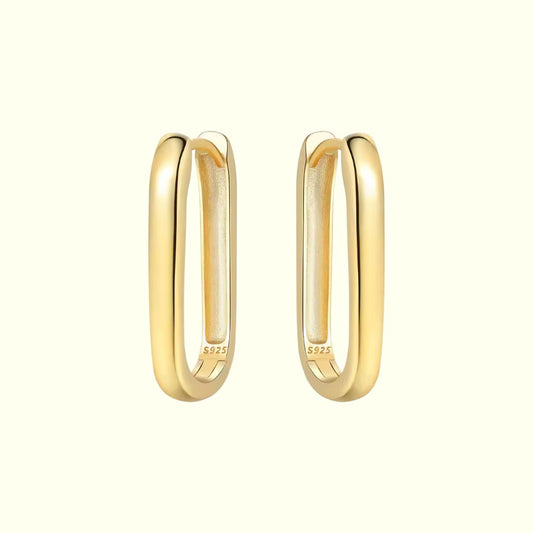 Gold hoop earrings on a white background