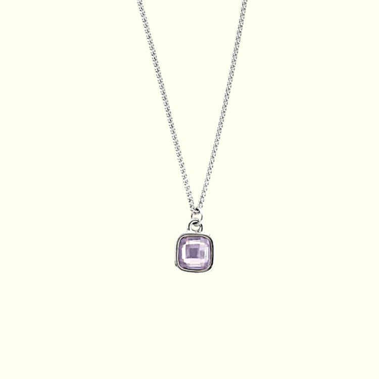 Necklace with a purple gemstone pendant on a white background