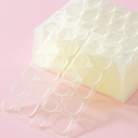 Clear silicone mold with heart shapes on a pink background